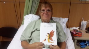 9/13/14 Hospital in Chonburi, holding the chrysalis to butterfly icon of this clinic - very appropriate.